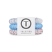 group of red white and blue hair ties on white background 