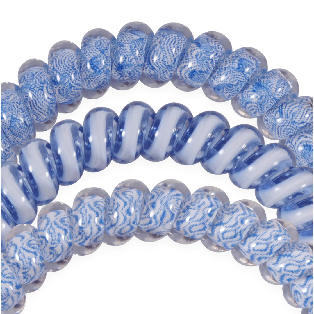 blue hairties on white background