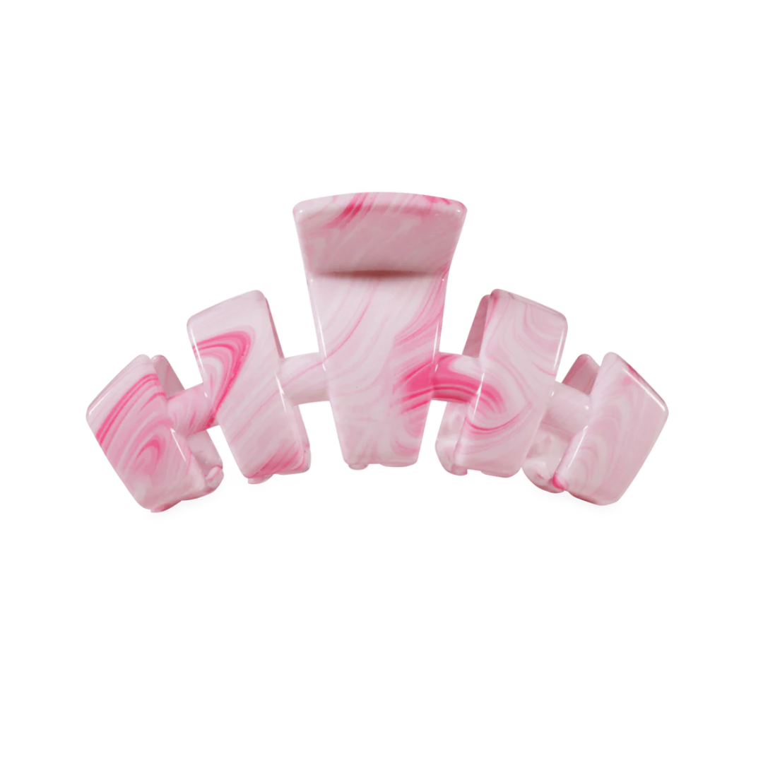 Pink and white marbled candy on a white background