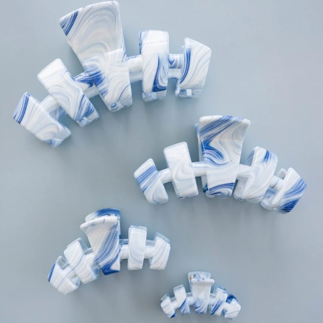 Marble-patterned dumbbells on a gray background