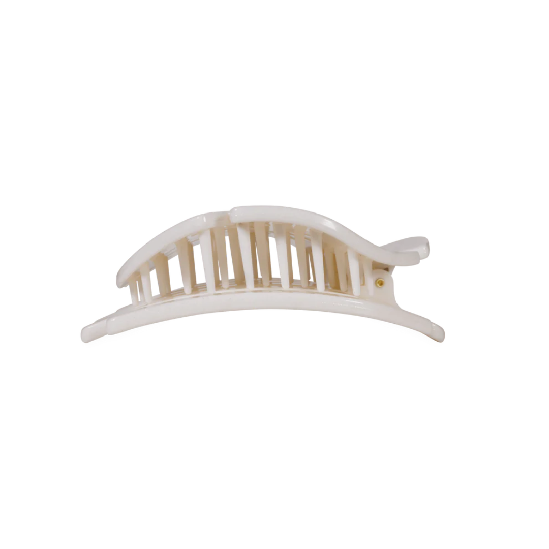 White hair clip with wooden center on a white background
