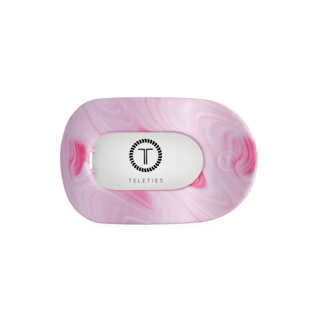 pink hair clip agaist white background