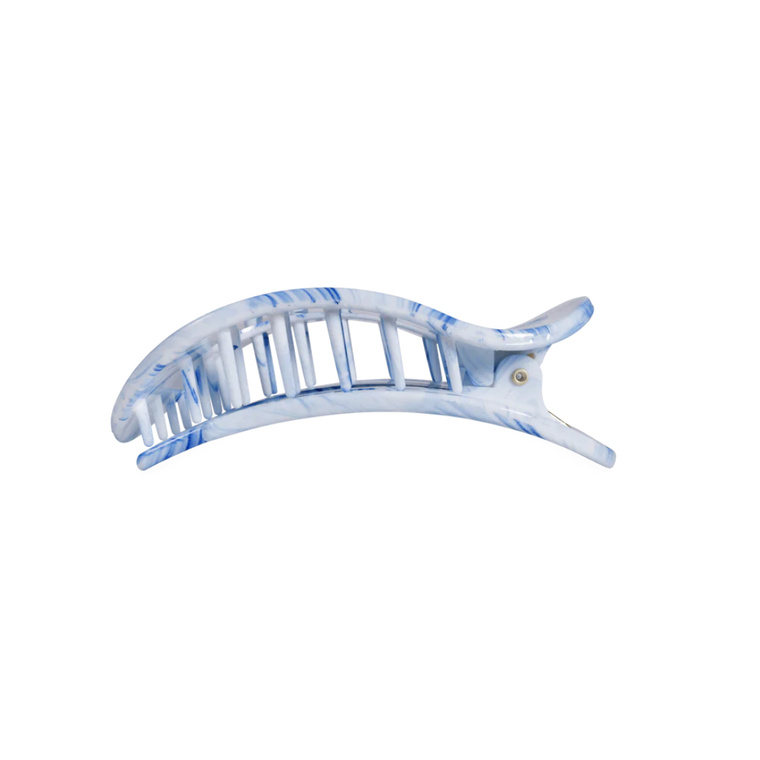 Blue and white hair clip on a white background