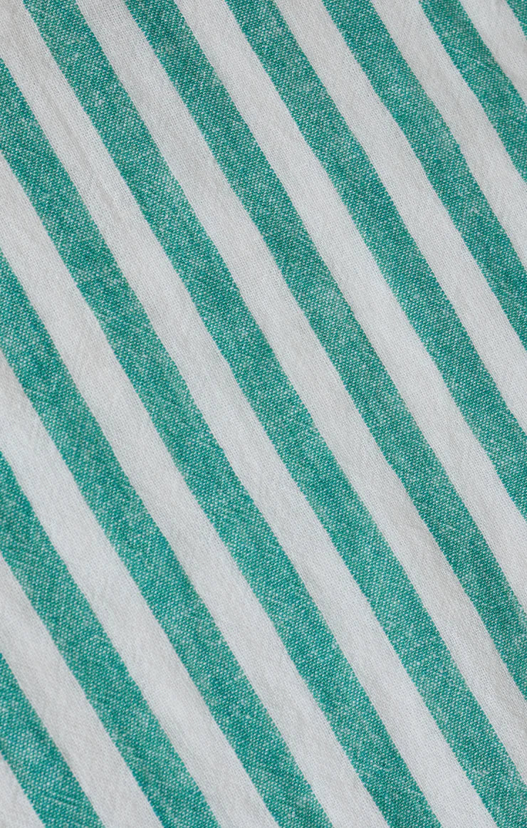 Close-up of fabric with green and white diagonal stripes