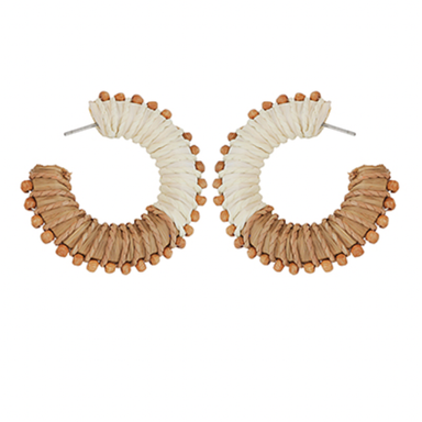 Pair of hoop earrings with beige and white design on a white background