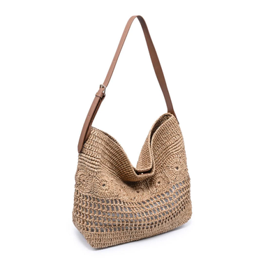 Woven handbag with a brown strap on a white background