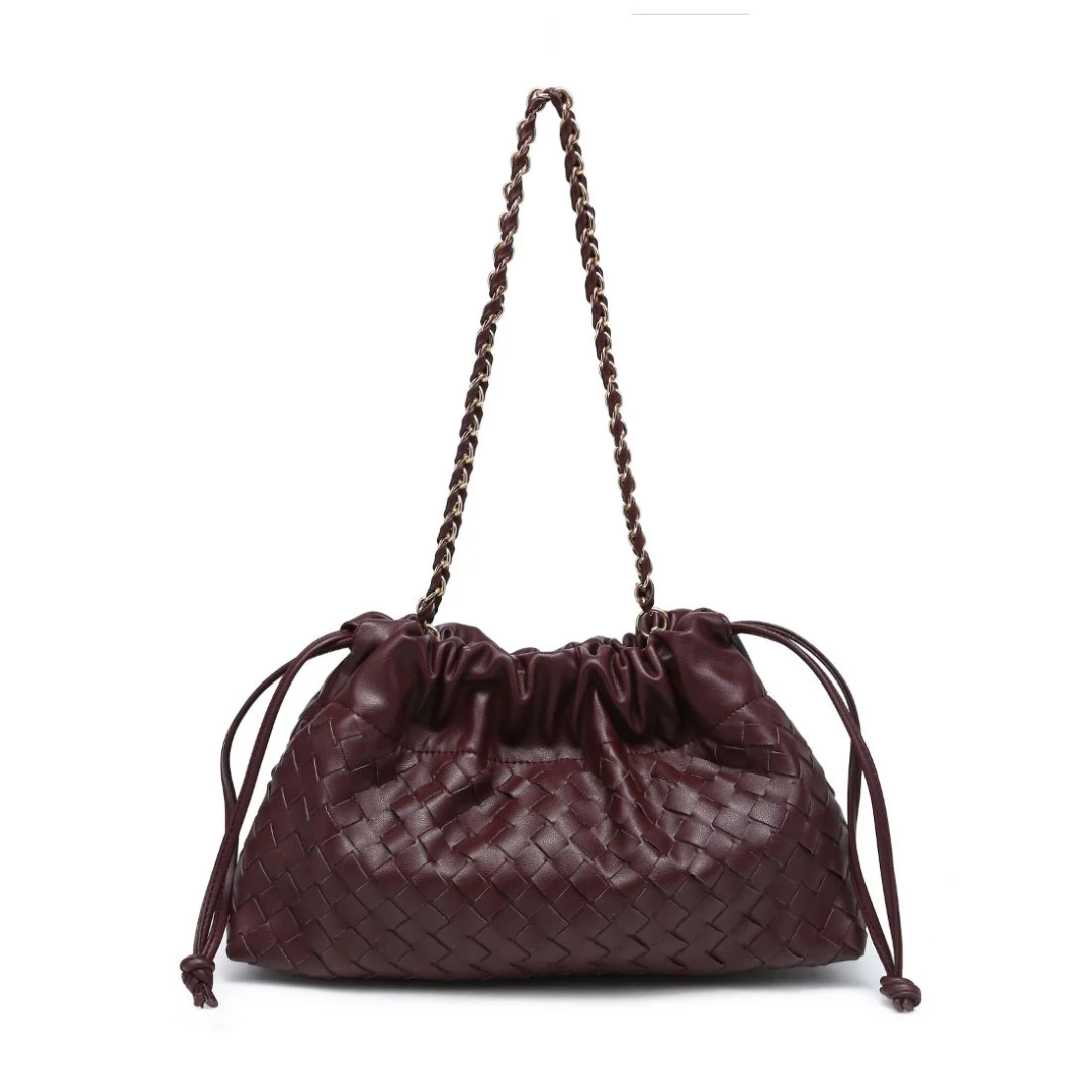 Brown woven handbag with a braided handle on a white background
