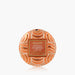 Voluspa Spiced Pumpkin Latte hand cream in a round, patterned orange container with a central label, set against a light gray background with a subtle reflection below.