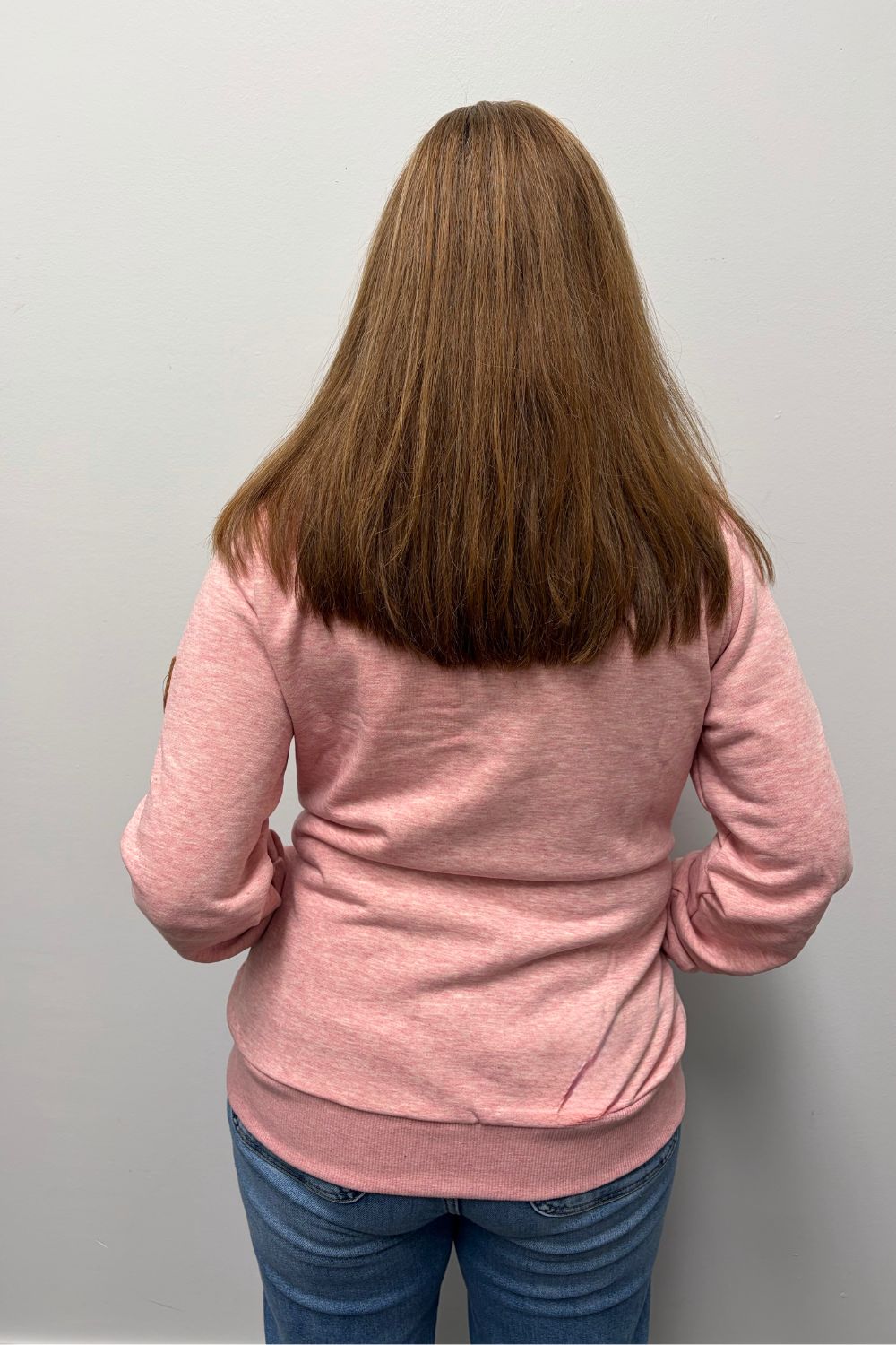 Woman wearing Wanakome Hestia Full-Zip Sweatshirt Heather Pink on a plain white background