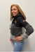 Woman wearing Wanakome Selene Hoodie In Black Carbon Mix on a plain white background.