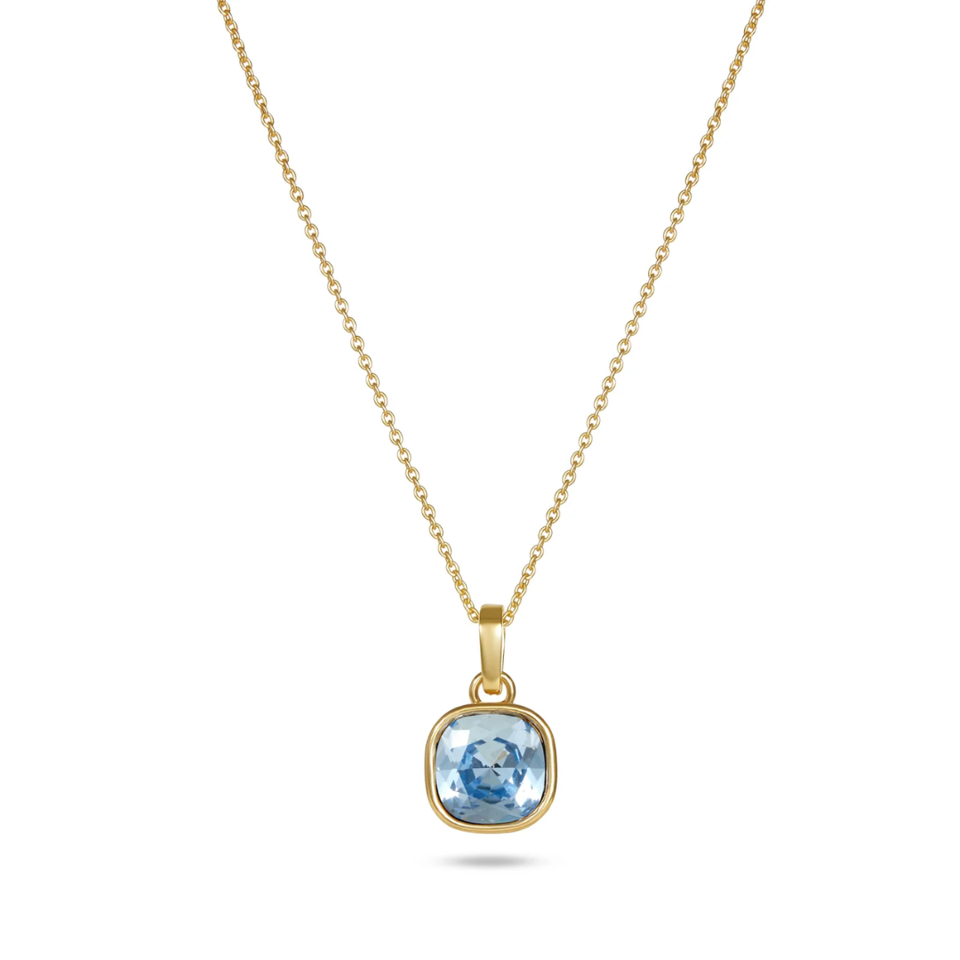 Gold necklace with a blue gemstone pendant on a white background