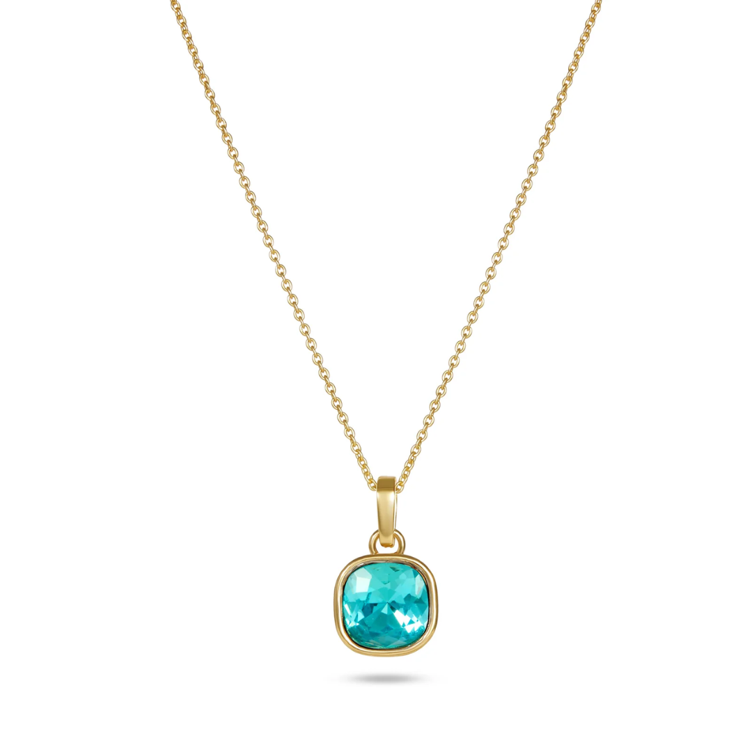 Gold necklace with a green pendant on a white background
