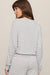woman wearing a striped sweater on a white background
