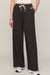 woman wearing black pants on a white background