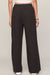 woman wearing black pants on a white background