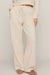 woman wearing white pants on a white background