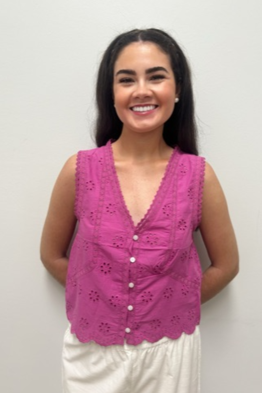 pink top on model against neutral background