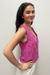 pink top on model against neutral background