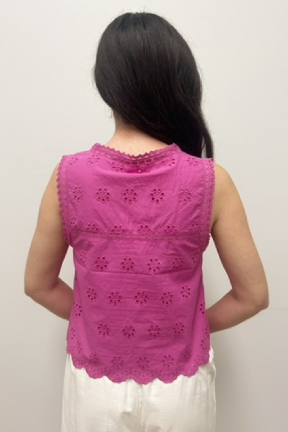 pink top on model against neutral background