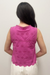 pink top on model against neutral background