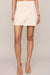woman wearing embroidered skirt with a white background