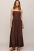 woman in brown dress on a white background