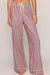 Red, green, and white plaid wide-leg pajama pants with an adjustable white drawstring waist.