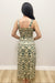 Woman wearing cream tank top with matching maxi skirt green floral detail