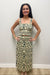 Woman wearing cream tank top with matching maxi skirt green floral detail