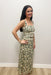 Woman wearing cream tank top with matching maxi skirt green floral detail