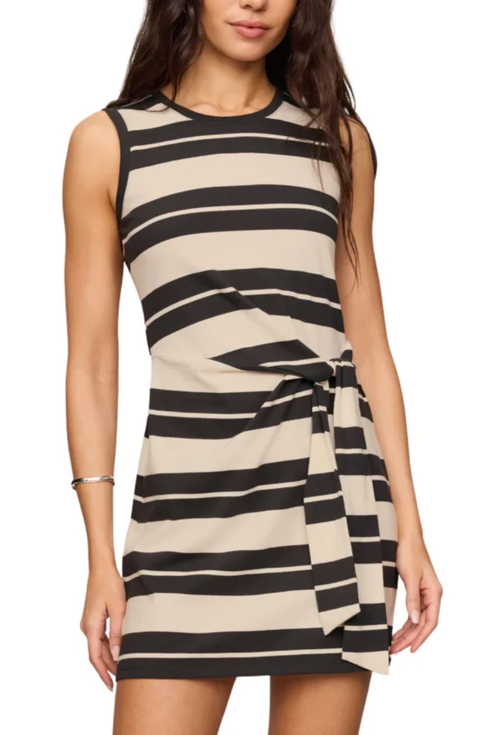 woman wearing black and tan striped mini dress on white background