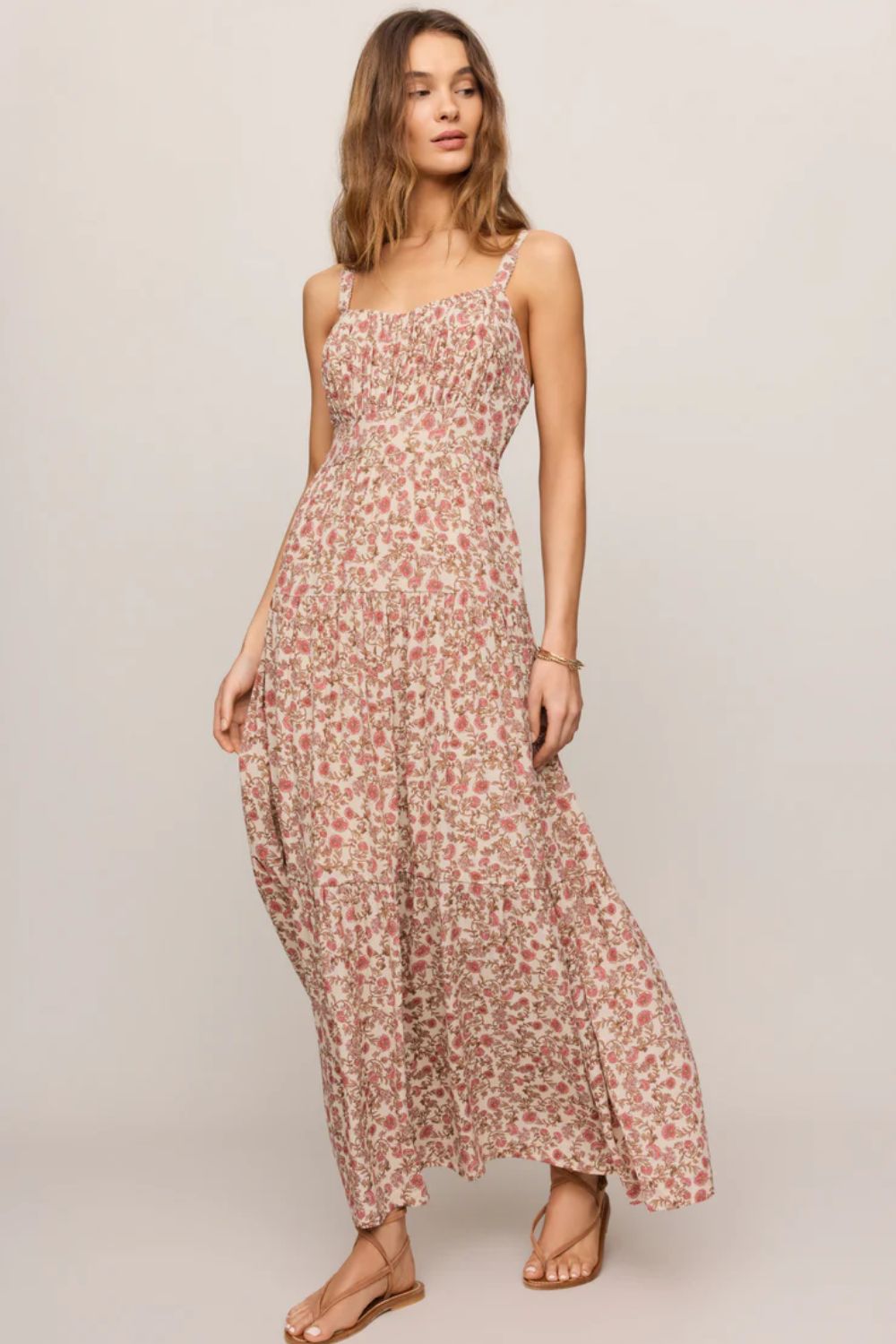 woman in floral dress on a white background