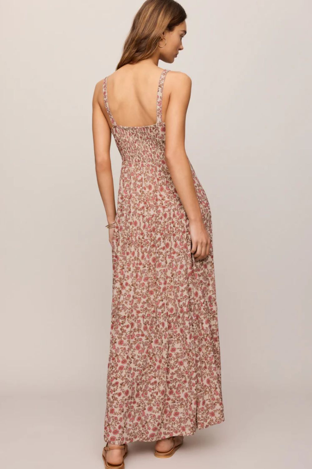 woman in floral dress on a white background