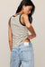 woman wearing a striped tank top on a white background