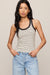 woman wearing a striped tank top on a white background