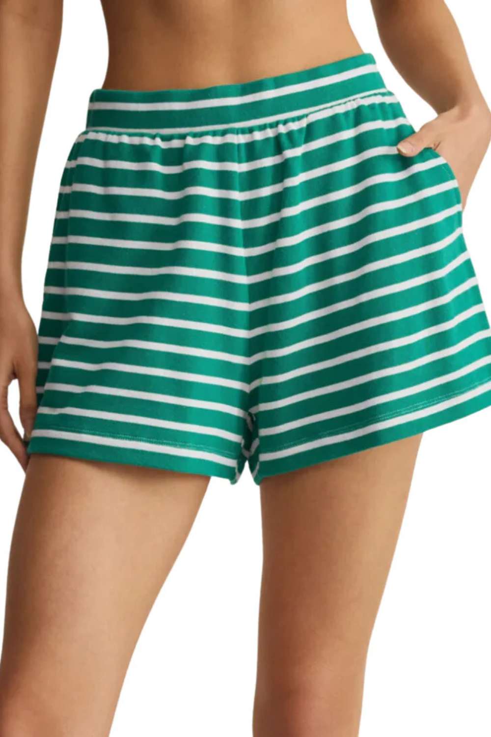 Green and white striped shorts on a plain background