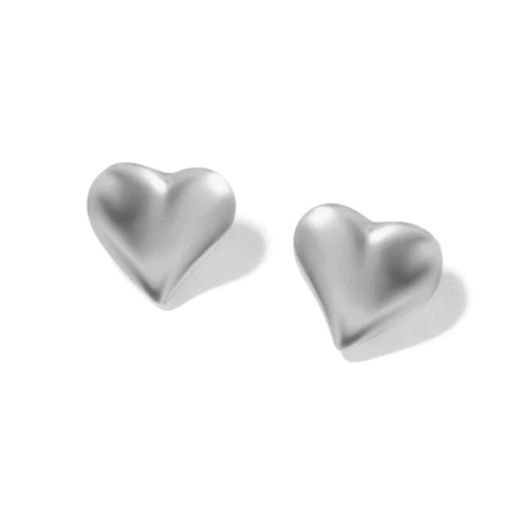 silver heart earring on white background