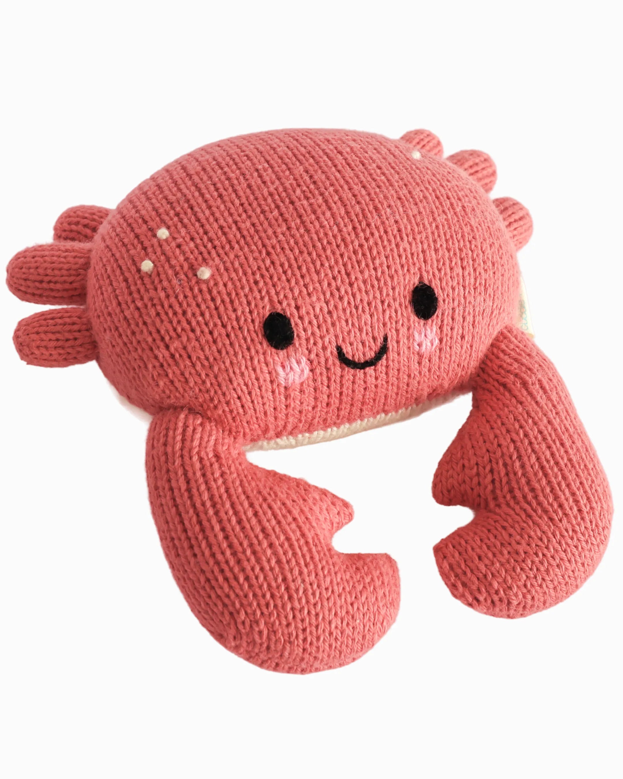 Hand-knit coral crab stuffed animal, front view