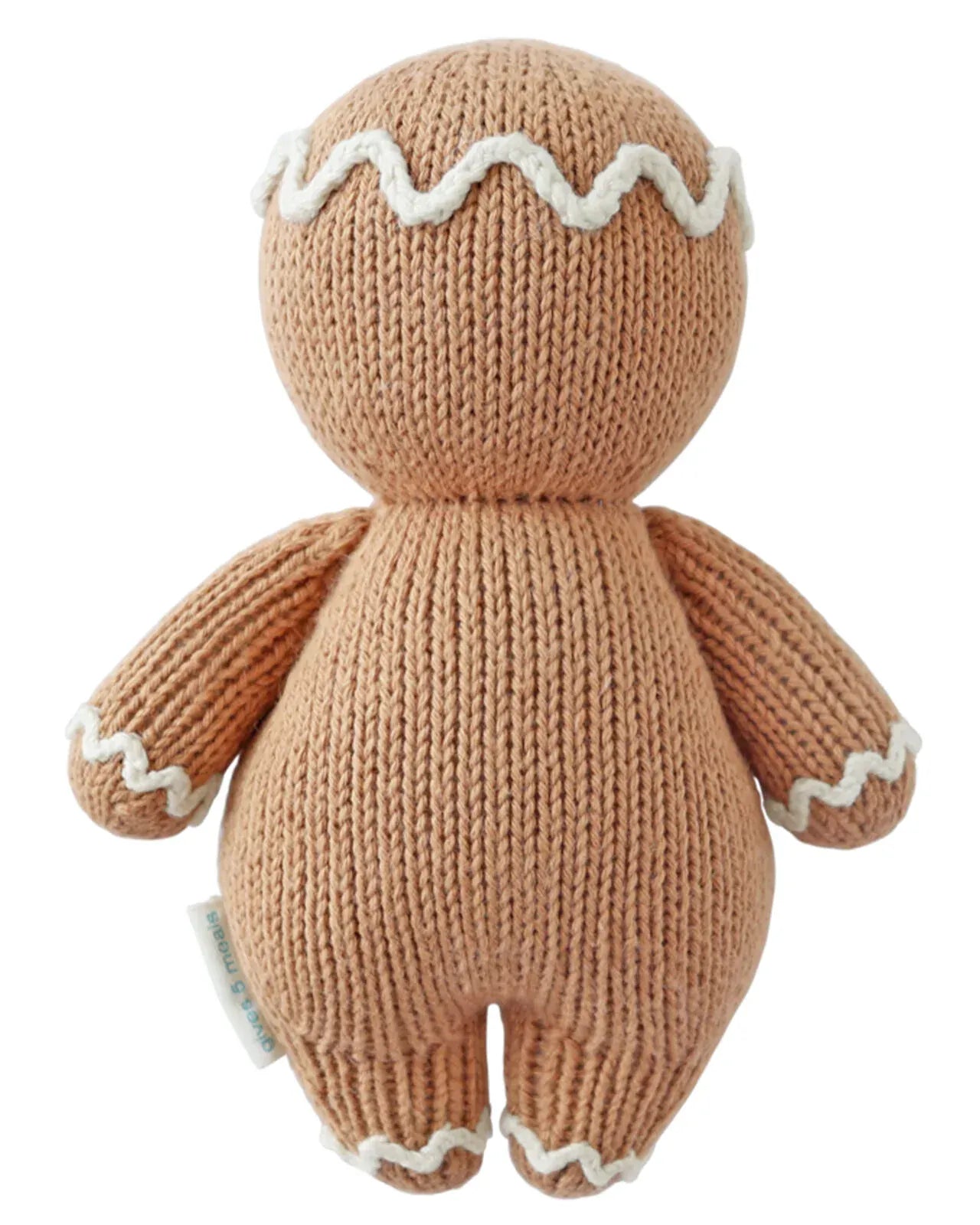 Back view of a hand-knit gingerbread stuffed toy