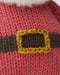 Close-up of a knit red Santa suit with a brown belt and gold buckle