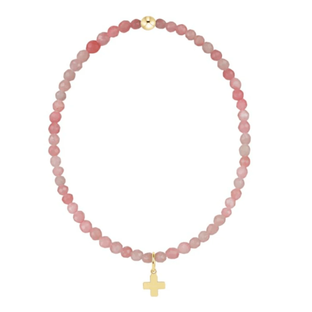 Necklace with pink beads and a gold cross charm on a white background