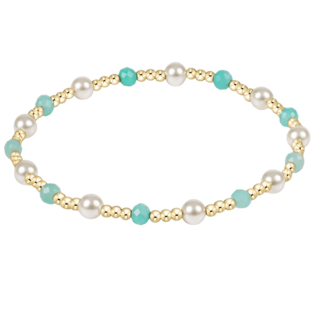 Bracelet with pearls and turquoise beads on a white background