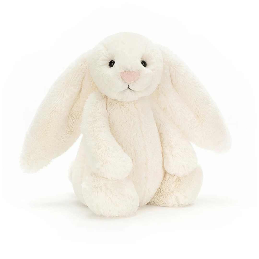 Cream-colored bunny plush toy on a white background