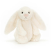 Cream-colored bunny plush toy on a white background