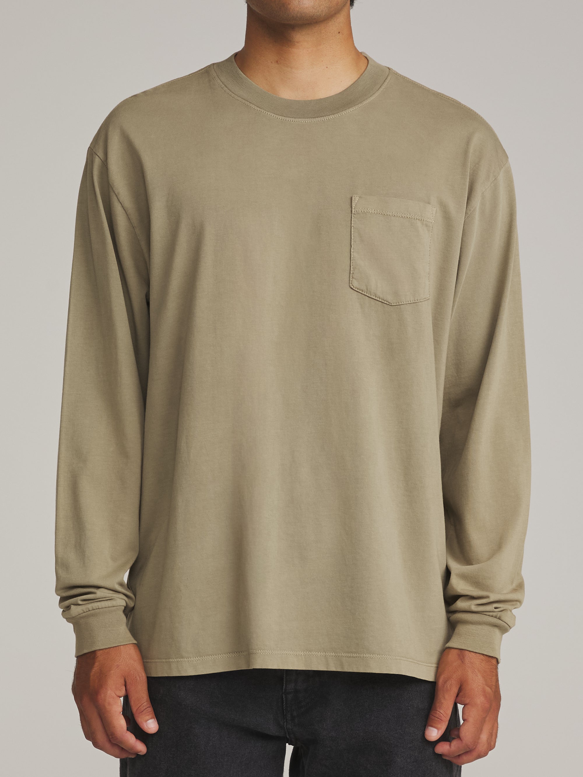 Man wearing the washed olive green Katin Base long sleeve tee, front view