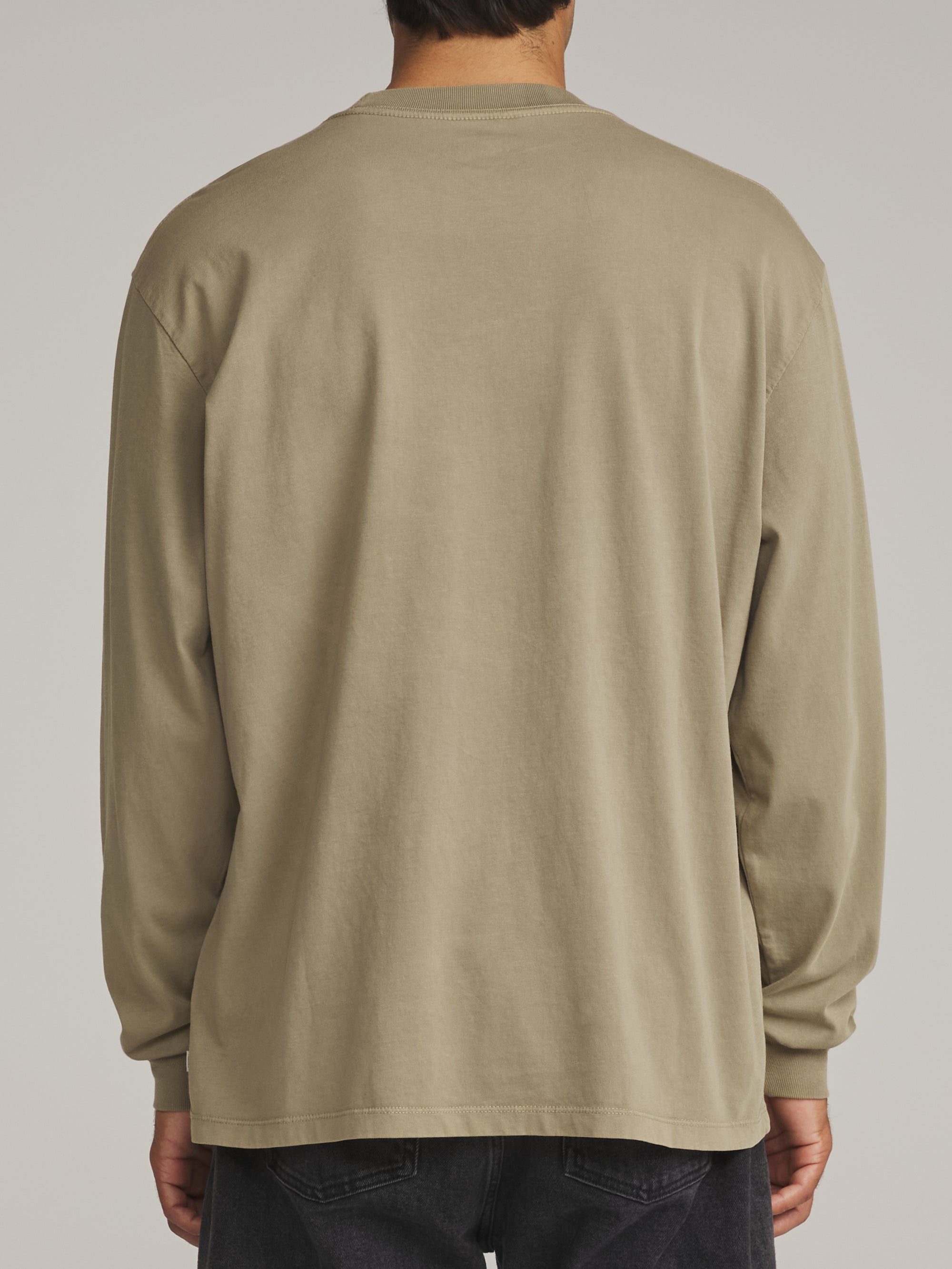 Back view of the washed olive green Katin Base long sleeve tee on a model