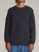 Man wearing the navy Katin Rivers crew neck sweater, front view