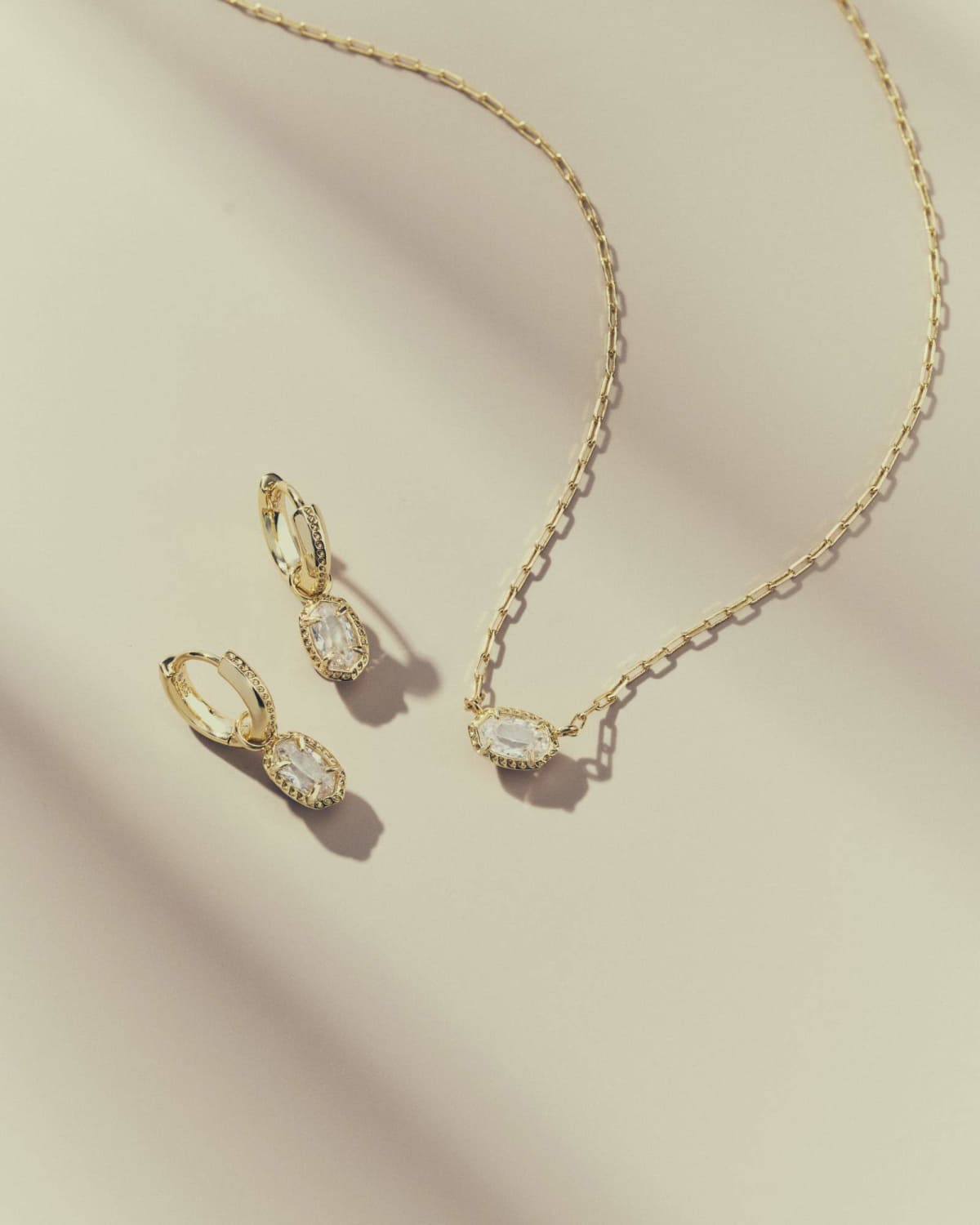 Kendra Scott Mini Ellie Luxe gold huggie earrings in White CZ, view 3