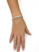 Model wearing the Little Words Project Survivor bracelet in pink beads