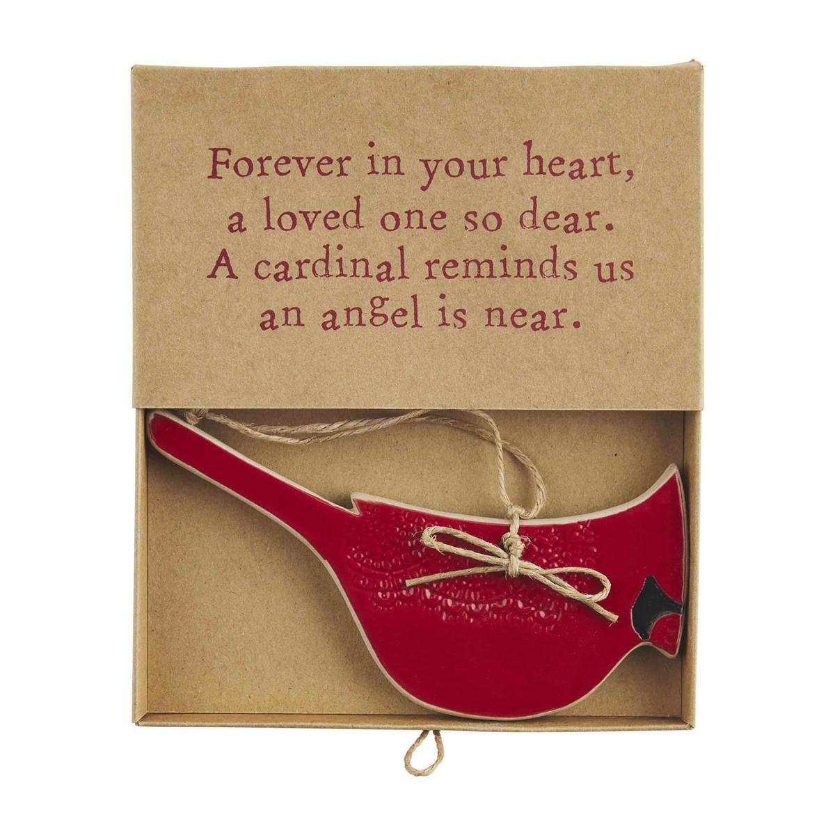 Red cardinal ornament in an open gift box with a printed sentiment